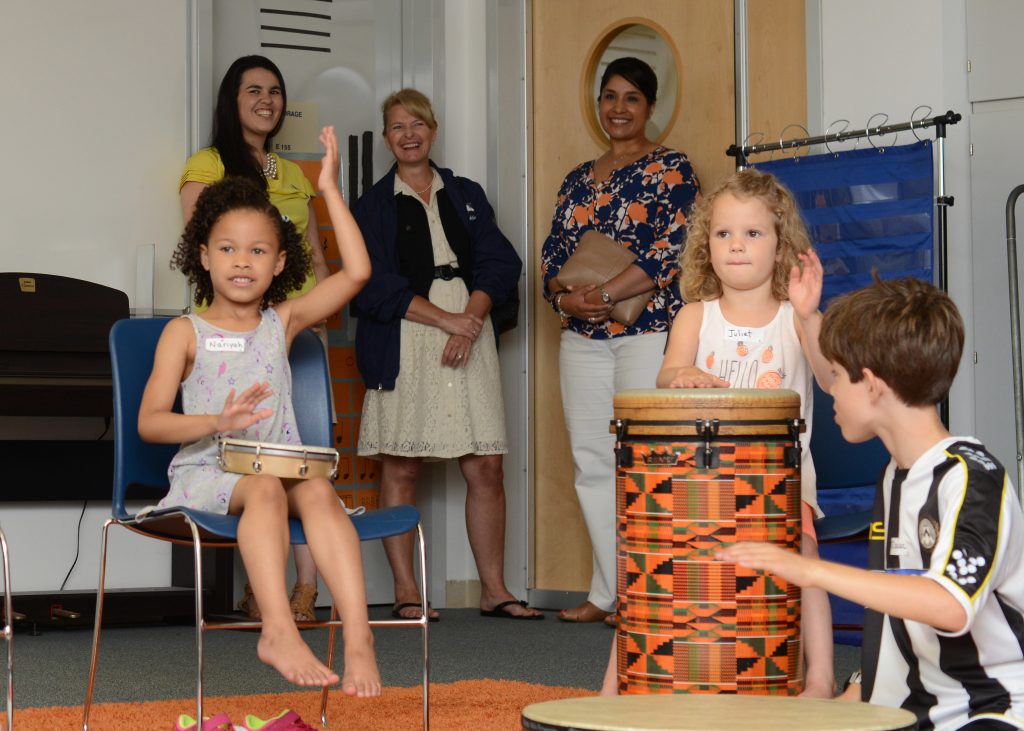 Children having fun playing instruments