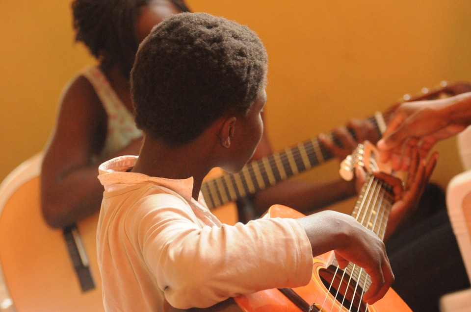 Little boy playing guitar